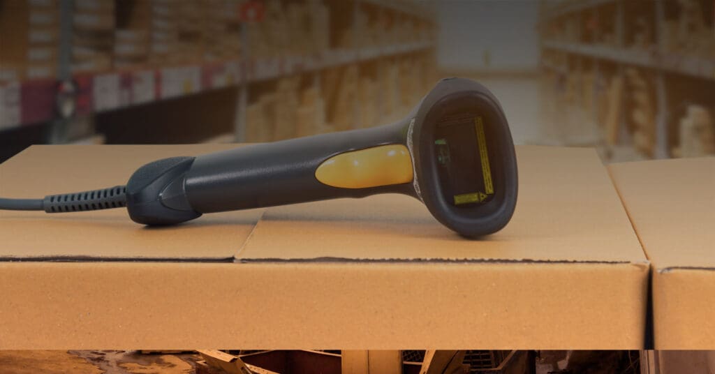 Photograph of a barcode scanner sitting on a box