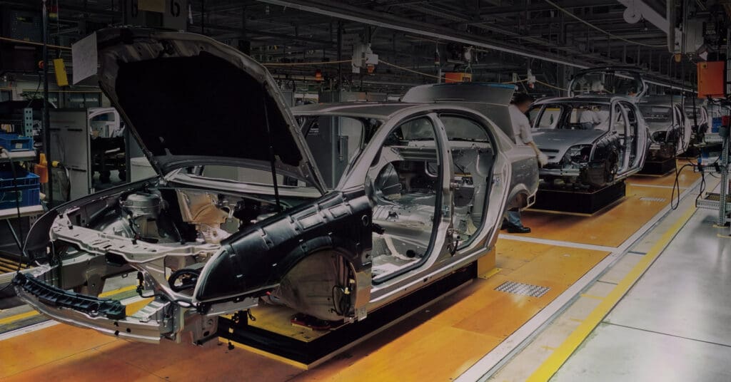 Photograph of cars being manufactured