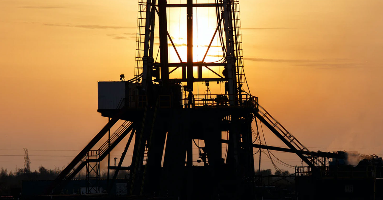 Heavy Outdoor Equipment in front of a sunset. Photo by WORKSITE Ltd. on Unsplash