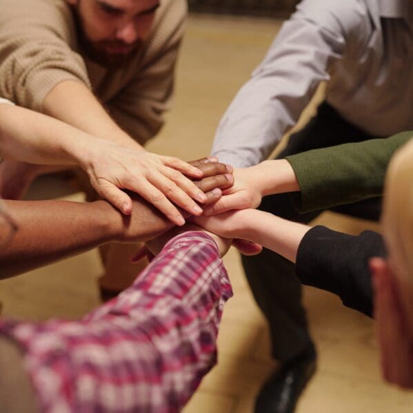 pile-of-hands-made-up-of-several-people-of-various-2021-09-24-03-43-06-utc